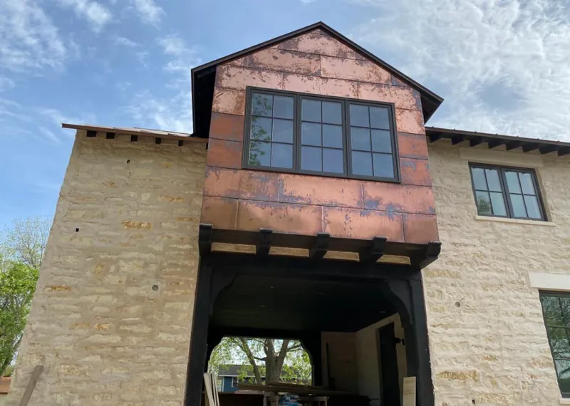 Copper metal panel facade on a stone building for Skylight Installation in Peachtree City