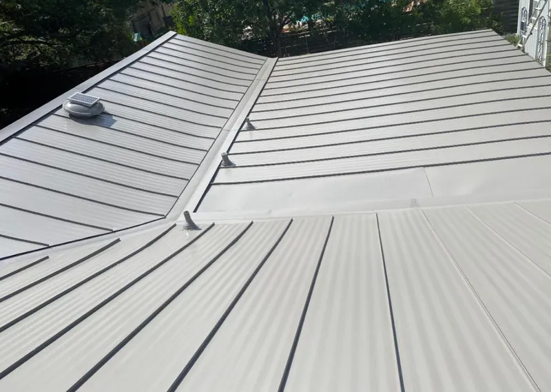 Solar attic fan installed on a metal roof for Roof Ventilation in Peachtree City